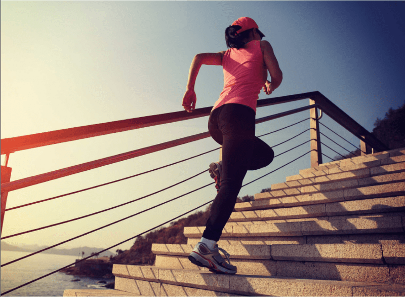 Woman running up stairs